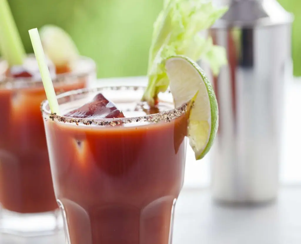 Tomato juice non-alcoholic cocktail with a fresh lime slice