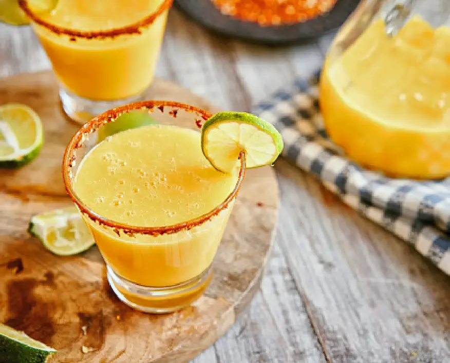 Mango non-alcoholic cocktail with a slice of fresh lime