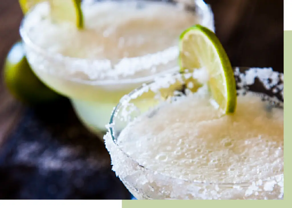 Margarita cocktail with a slice of lime & sugar crystals